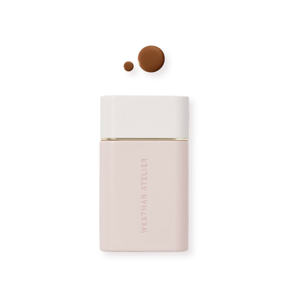 Westman Atelier Radiant Skin Tint in a sleek bottle with two dots of tint swatched above