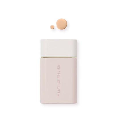 Westman Atelier Radiant Skin Tint in a sleek bottle with a drop of tint above for a natural glow