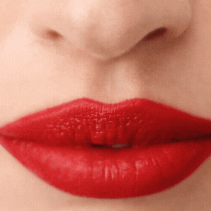 Close-up of vibrant red lips showcasing Westman Atelier Comfortable Matte Lipstick for a bold look