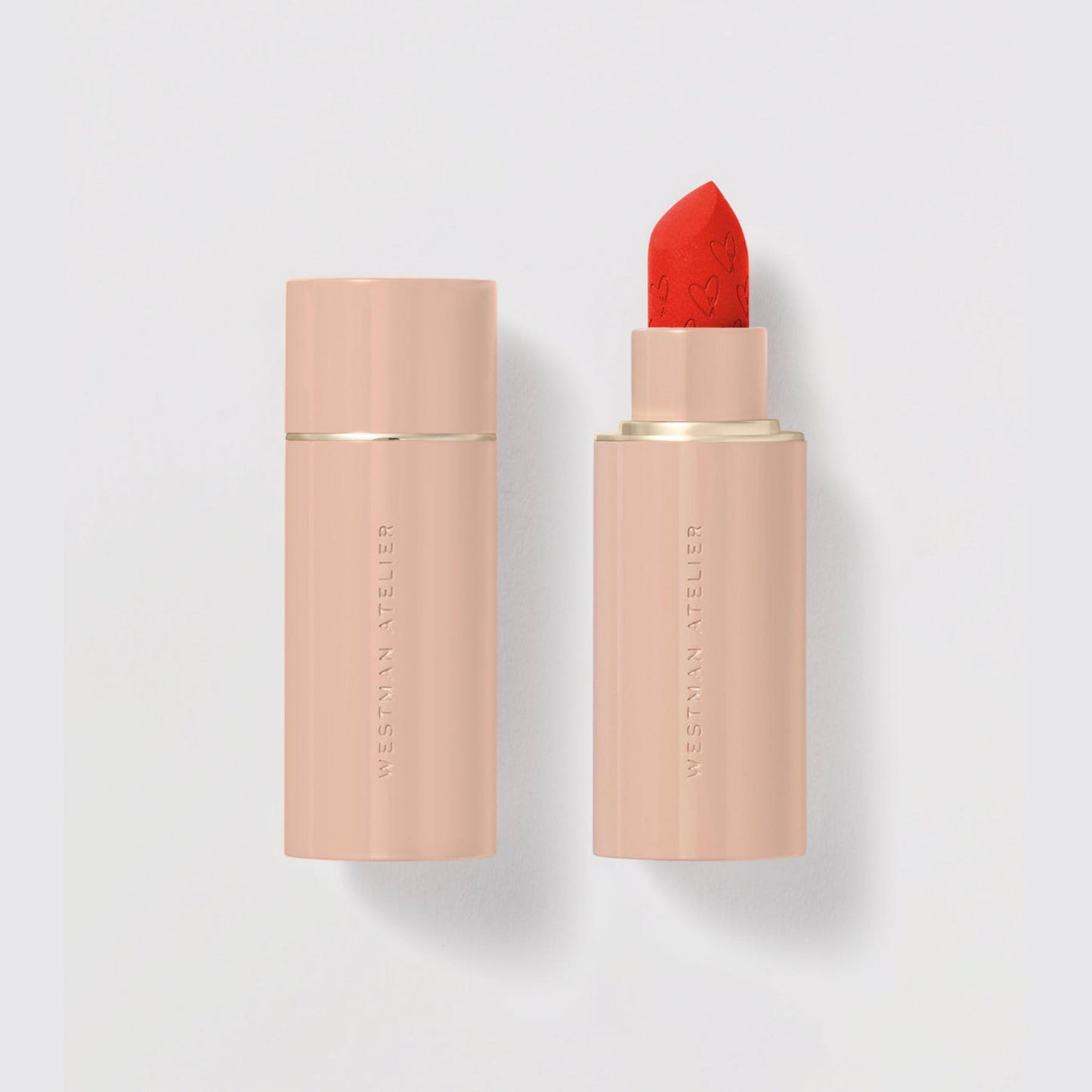 Westman Atelier Comfortable Matte Lipstick in vibrant red with sleek packaging for effortless application