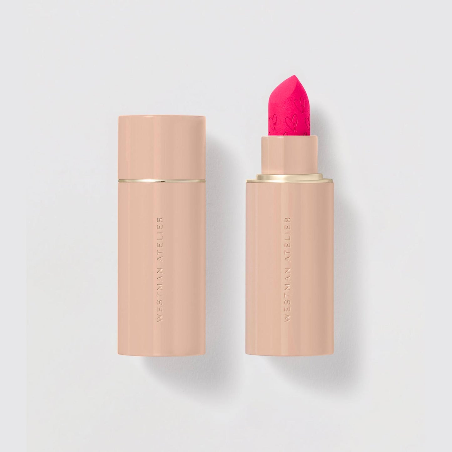 Westman Atelier Comfortable Matte Lipstick in vibrant pink shade for a smooth finish