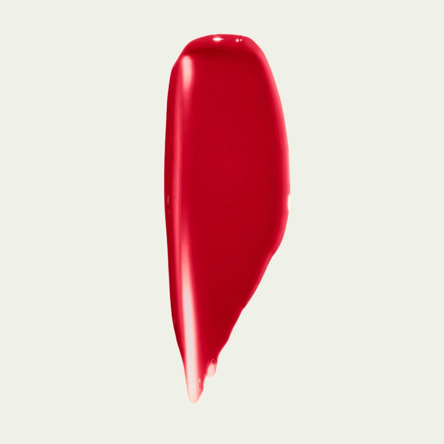 Wonderblush Tinted Lip Oil in a vibrant red shade with a smooth and glossy finish