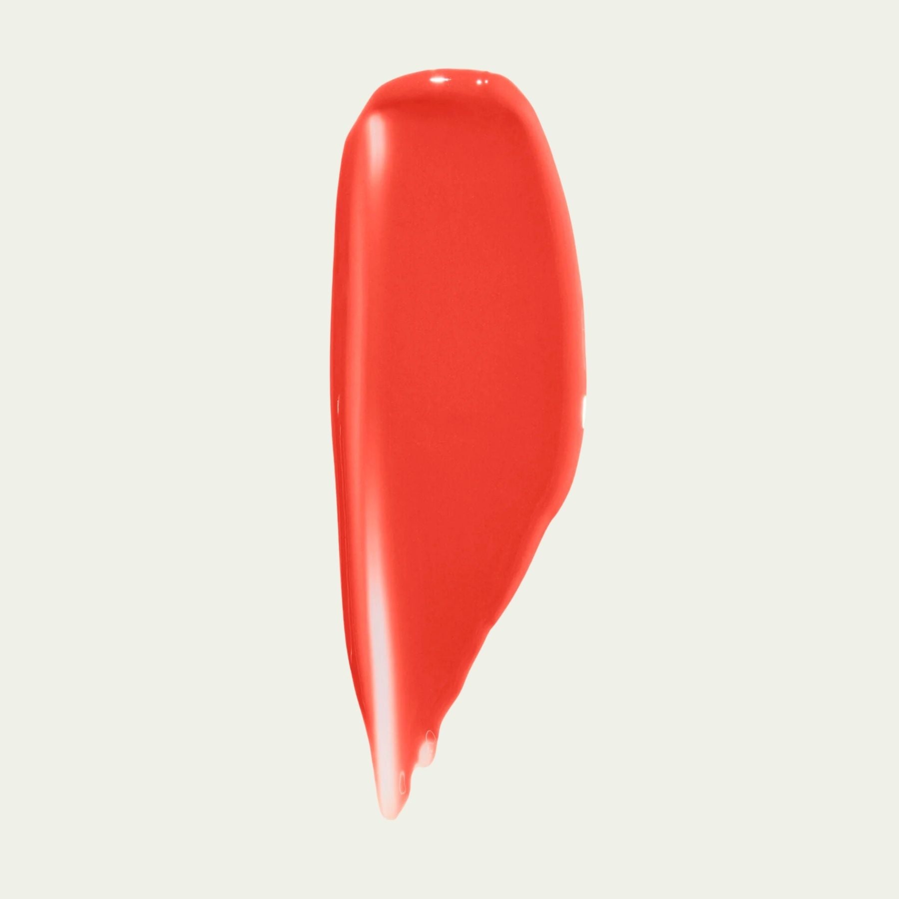 Vibrant red swatch of Wonderblush Tinted Lip Oil on a light background