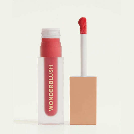 Wonderblush Tinted Lip Oil in a clear tube with a vibrant red color and applicator wand